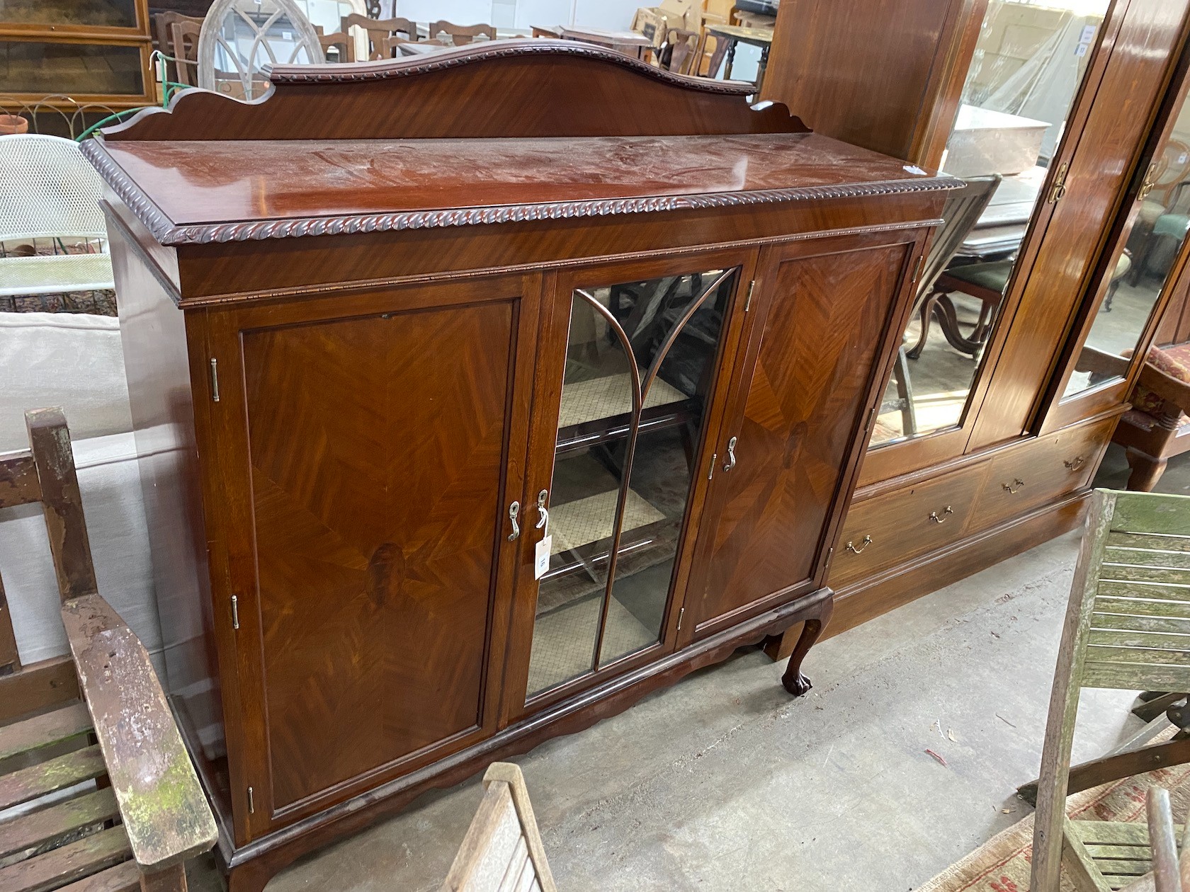 A 1920s mahogany side cabinet, width 137cm, depth 38cm, height 142cm